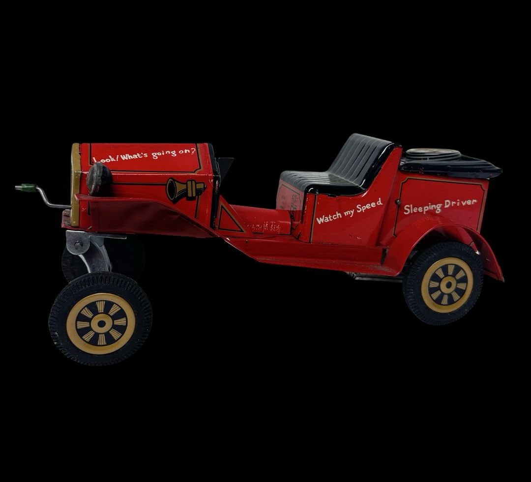 Vintage Ca 1950s Japanese Tin Friction Car Toy: Good vintage condition with wear and patina according to use and age, please see pictures. Measures approx. 8" long and 3 1/2" wide and 3" high.
