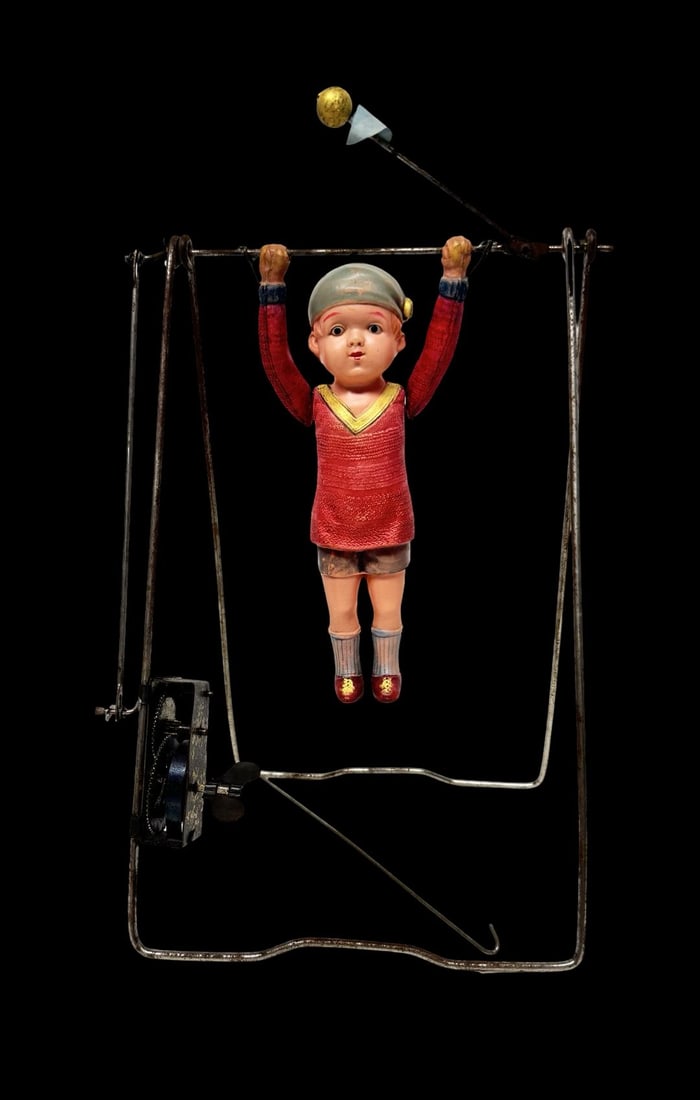Antique Ca. 1920s Mechanical Wind-Up Acrobat Boy Toy: Good vintage condition with wear and patina according to use and age, please see pictures. Measures approx. 5" long and 5 1/2" wide and 10" high. Made in Japan.