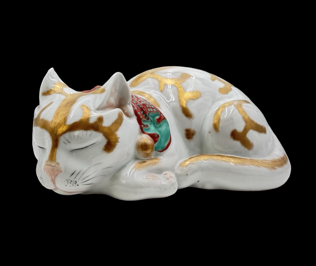 Beautiful Vintage Japanese Porcelain Cat Figurine: Very good vintage condition. Small chip on the right ear. Measures approx. 9 1/2" long and 6" wide and 4 1/2" high.