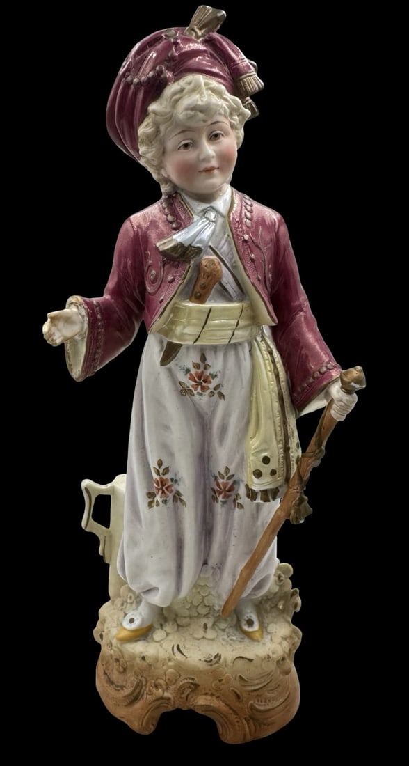 Antique SCHNEIDER Germany Porcelain Figurine of a Boy in Oriental Attire: Very good antique condition. No chips, cracks or repairs. Measures approx. 12 3/4" high x 5" wide.