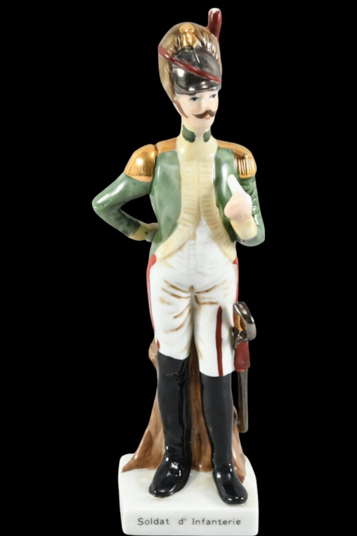 Vintage European Hand Painted Porcelain Infantery Soldier Figurine: Very good vintage condition; no chips, cracks, or repairs; minor paint loss. Measures approx. 8 1/4" high x 3 1/2" wide. Marked on the bottom.
