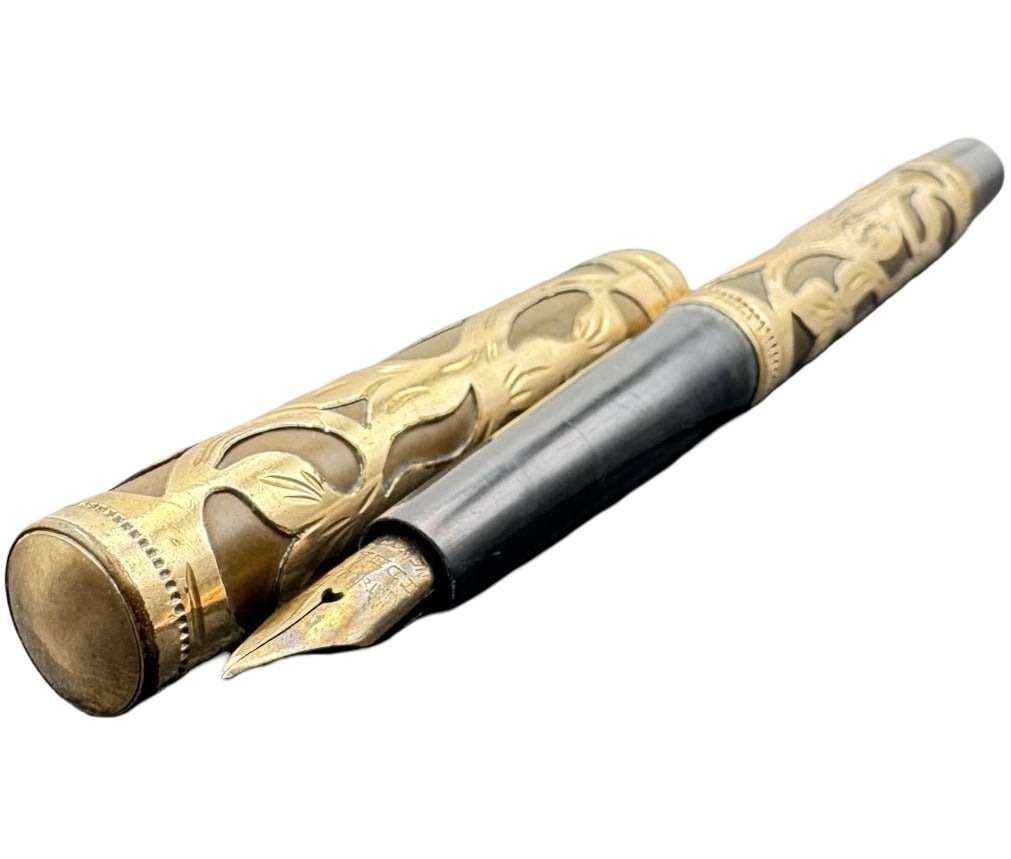 Antique ca. 1910 WATERMAN'S "IDEAL" Fountain Pen w/ Pierced 14K Gold Filigree Design & 14K Gold Nib: Good antique condition with wear and patina according to age; missing the clip. Measures approx. 5.1" long x 1/4" wide and weighs ca. 14.52 grams. Marked 14K, WATERMAN'S & engraved with a monogram.