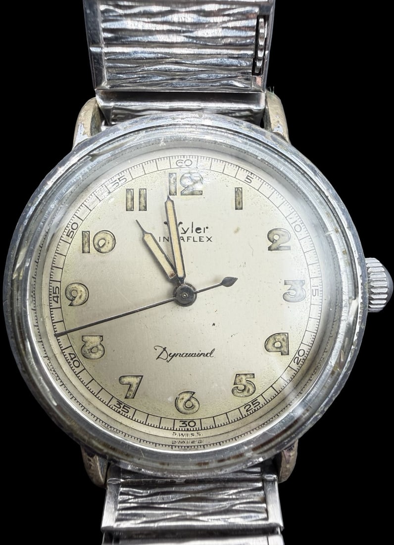 Unusual Vintage WYLER Stainless Steel, Gold Tone & Stretchable Strap Quartz Watch /w Calendar: Good vintage condition w/ patina and wear according to age and use, see pictures. Measures approx. 1" long and 1" wide. Marked for WYLER. Watch is working.