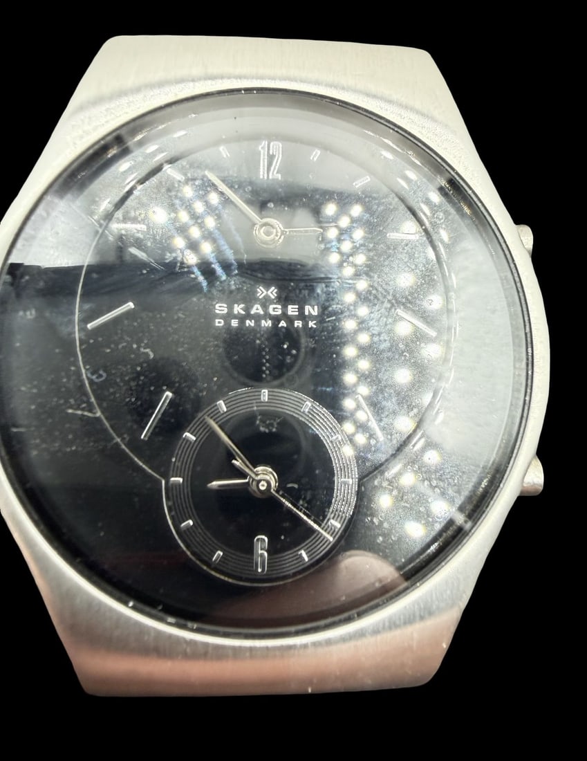 Amazing Vintage SKAGEN Denmark Stainless Steel & Black Dial Watch w/ Box: Good vintage condition w/ patina and wear according to age and use, see pictures. Dial measures approx. 1" long and 1" wide and the piece weighs ca. 41.9 grams. Marked for SKAGEN. The timepiece is wor