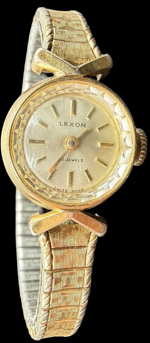 Stunning Vintage LEXON Gold Tone w/ 7 Jewels & Stretchable Strap Women's Watch: Good vintage condition w/ patina and wear according to age and use, see pictures. Measures approx. 3/4" long and 3/4" wide. Marked for LEXON. Watch isn 't working.