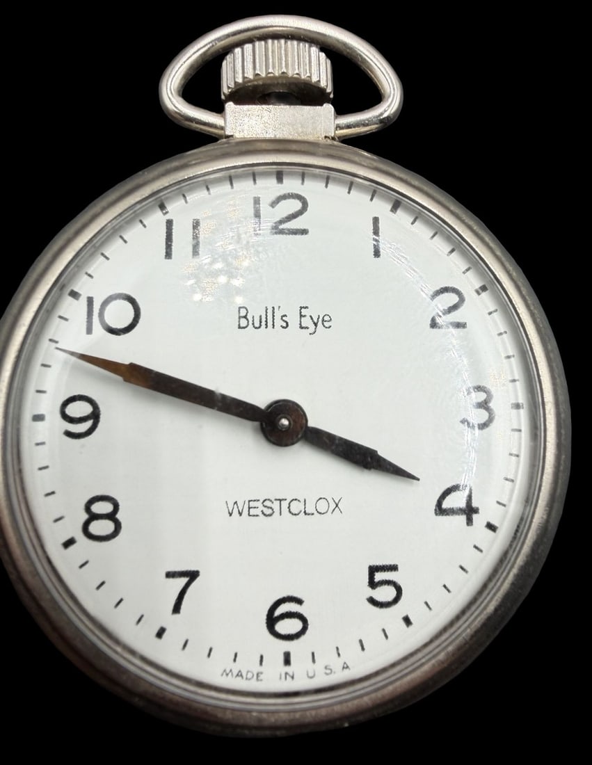 Gorgeous Ornate Vintage BULLS EYE Silver-Tone Metal & White Dial Pocket Watch: Good vintage condition w/ patina and wear according to age and use, see pictures. Dial measures approx. 1 1/2" long and 1 1/2" wide and weighs ca. 37.6 grams. Marked for BULLS EYE. The timepiece is fu