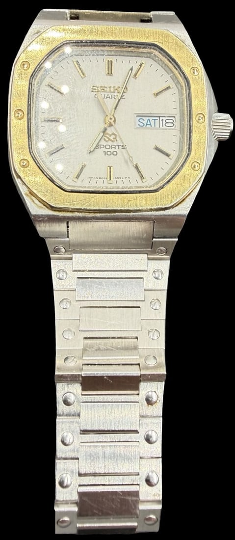 Gorgeous Vintage SEIKO 100 Sports Stainless Steel Silver & Gold Tone Quartz Watch: Good vintage condition w/ patina and wear according to age and use, see pictures. Measures approx. 1" long and 1" wide. Marked for SEIKO. Watch is working.