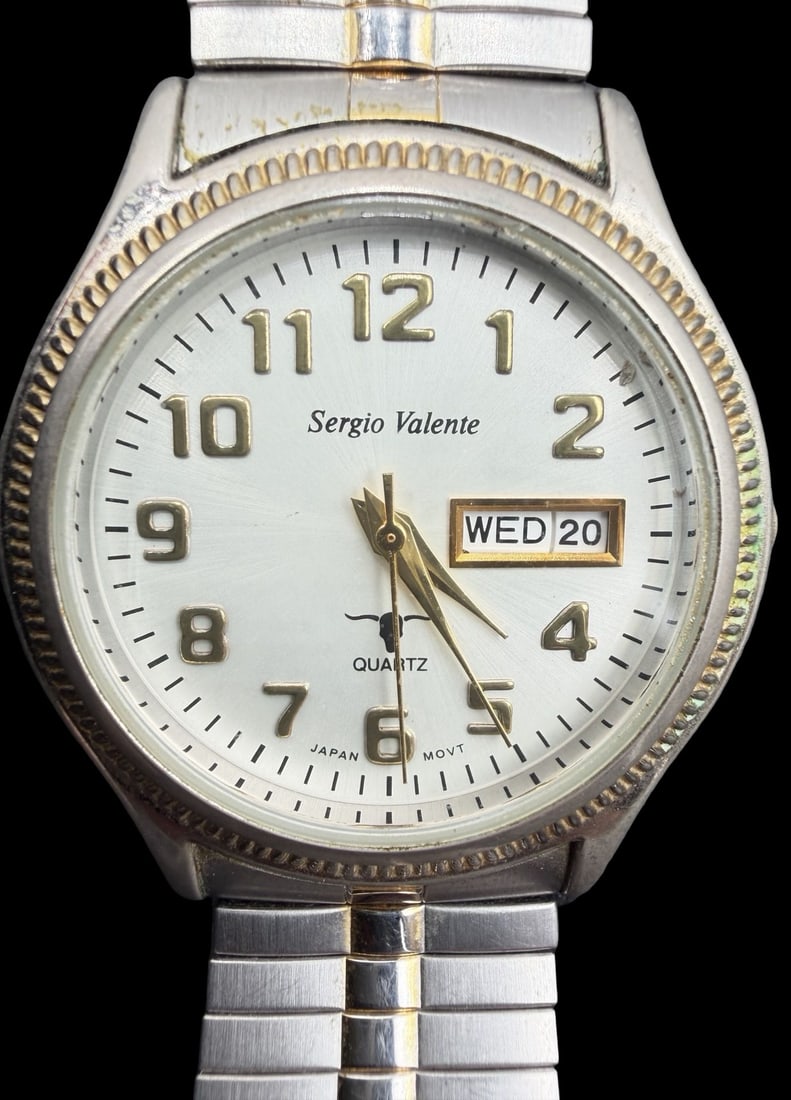 Vintage SERGIO VALENTE Stainless Steel Gold-Tone Quartz Watch: Good vintage condition w/ patina and wear according to age and use, see pictures. Dial measures approx. 1" long and 1" wide and weighs ca. 56.57 grams. Marked for SERGIO VALENTE. The timepiece is func