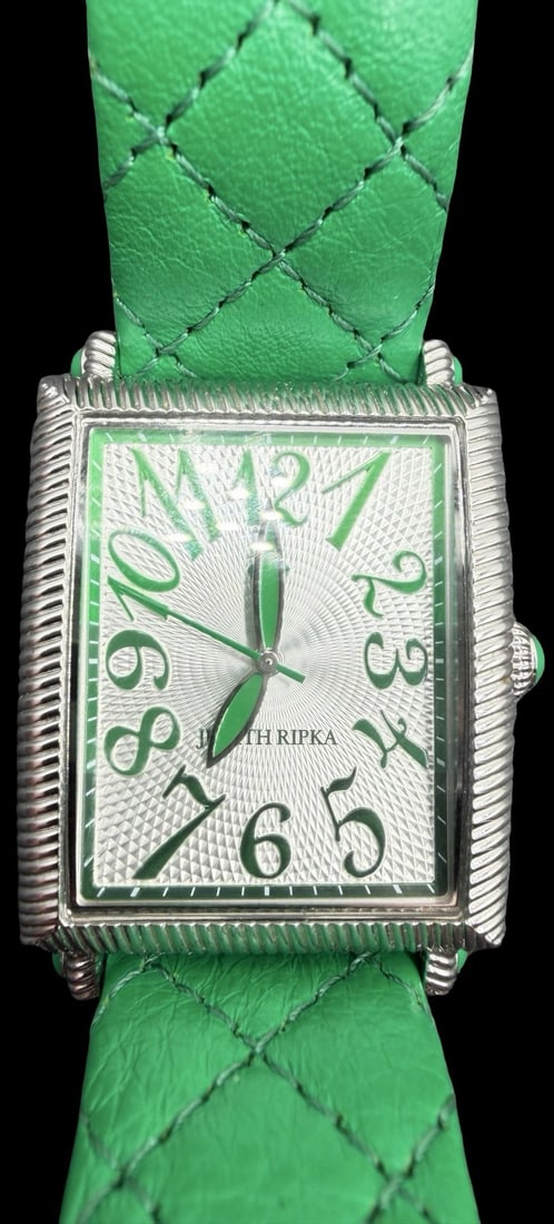 Beautiful Vintage JUDITH RIPKA Stainless Steel Silver Tone w/ Green Leather Strap Quartz Watch: Good vintage condition w/ patina and wear according to age and use, see pictures. Measures approx. 1 1/4" long and 3/4" wide . Marked for JUDITH RIPKA. Watch is working.