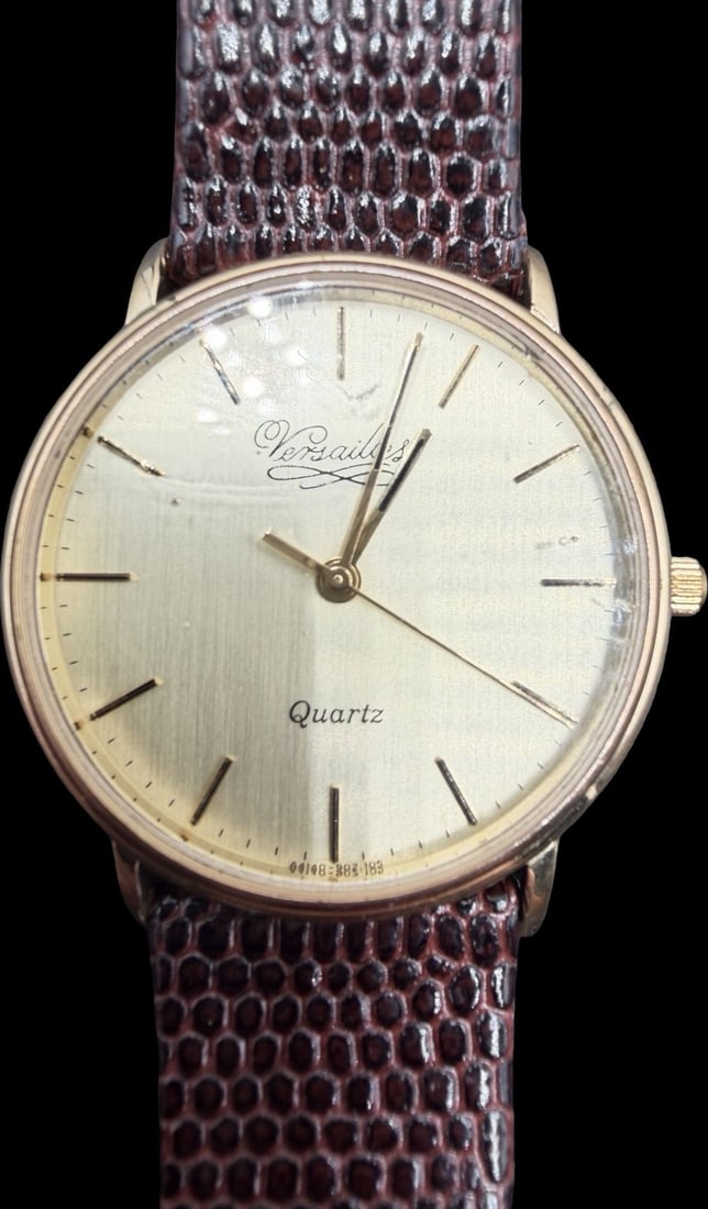 Beautiful Vintage VERSAILLES Stainless Steel Gold Tone & Brown Leather Strap Quartz Watch: Good vintage condition w/ patina and wear according to age and use, see pictures. Measures approx. 1" long and 1" wide. Marked for VERSAILLES. Watch is working.