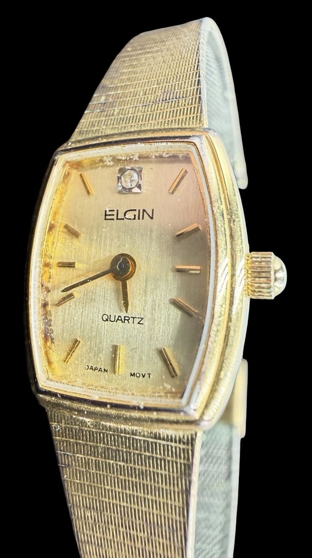 Vintage ELGIN Gold-Tone Stainless Steel & Clear Rhinestone Quartz Watch: Good vintage condition w/ patina and wear according to age and use, see pictures. Dial measures approx. 3/4" long and 1/2" wide and weighs ca. 19.47 grams. Marked for ELGIN. The timepiece is not worki
