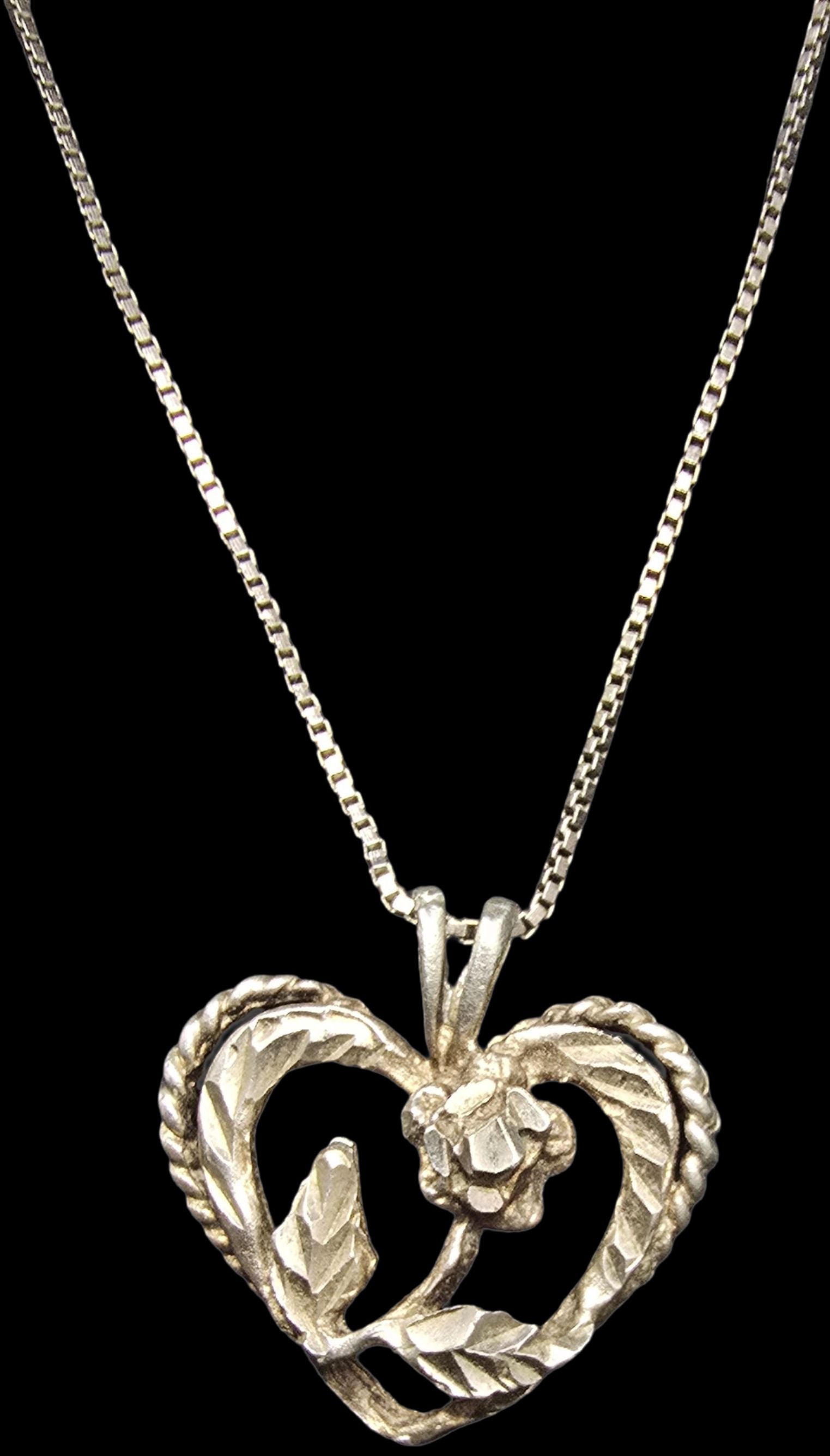 Stunning Ornate Vintage Sterling Silver Heart & Flower Shaped Pendant Necklace: Good vintage condition w/ patina and wear according to age and use, see pictures. Weighs ca. 3.5 grams. Necklace is 19" long. Marked Sterling Silver
