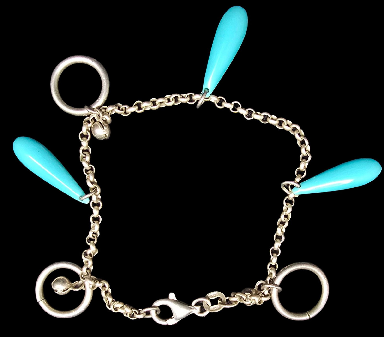 Stunning Ornate Vintage Sterling Silver Blue Charm Bracelet: Good vintage condition w/ patina and wear according to age and use, see pictures. Weighs ca. 7.5 grams. Measures 3 " wide. Marked Sterling Silver