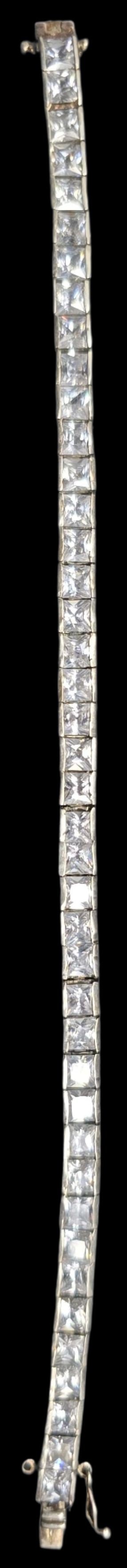 Beautiful Vintage Sterling Silver Rhinestone Tennis Bracelet: Good vintage condition w/ patina and wear according to age and use, see pictures. Measures approx 8" wide. Weighs ca. 21.5 grams. Marked Sterling Silver