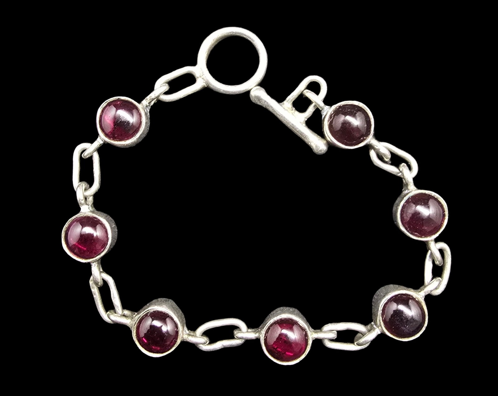 Gorgeous Vintage European Sterling Silver & Red Gemstone Chain Bracelet: Good vintage condition w/ patina and wear according to age and use, see pictures. Measures approx. 6 1/2 " long and weighs ca. 13 grams. Marked Sterling Silver