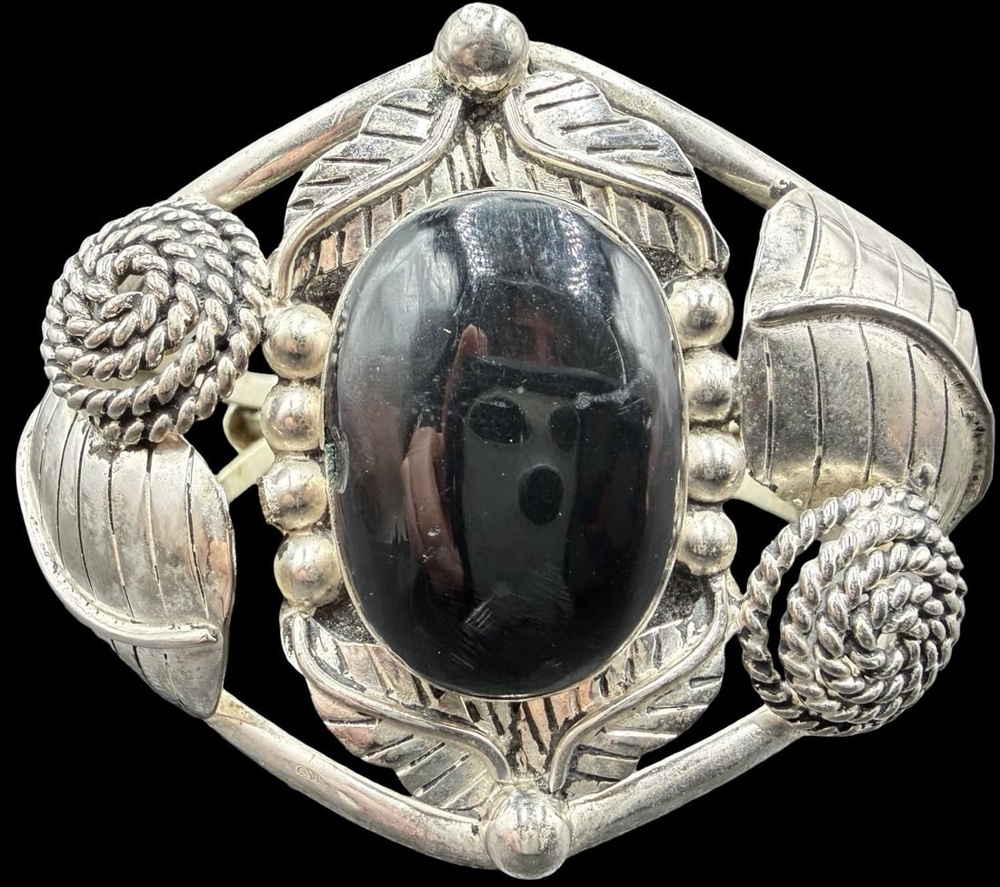 Stunning Ornate Vintage Sterling Silver & Black Onyx Bangle Bracelet: Good vintage condition w/ patina and wear according to age and use, see pictures. Measures approx. 3" long and 2 1/2" wide and weighs ca. 46.3 grams. Gemstone is 1" long and 3/4" wide. Marked Sterling