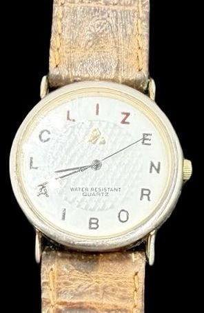 Gorgeous Ornate Vintage LIZ CLAIBORNE Stainless Steel Gold Tone & White Dial Quartz Watch: Good vintage condition w/ patina and wear according to age and use, see pictures. Measures approx. 1" long and 1" wide. Marked for LIZ CLAIBORNE. Watch isn't working.