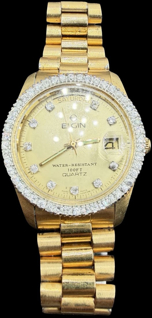 Gorgeous Vintage ELGIN Stainless Steel Gold Tone & Cluster Clean Rhinestones Quartz Watch: Good vintage condition w/ patina and wear according to age and use, see pictures. Measures approx. 1" long and 1" wide and weighs ca. 117.84 grams. Marked for ELGIN. Watch isn't working.