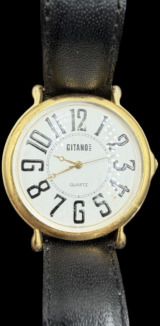 Gorgeous Vintage GITANO Stainless Steel Gold Tone & White Dial Quartz Watch: Good vintage condition w/ patina and wear according to age and use, see pictures. Measures approx. 1 1/2" long and 1 1/2" wide. Marked for GITANO. Watch isn't working.