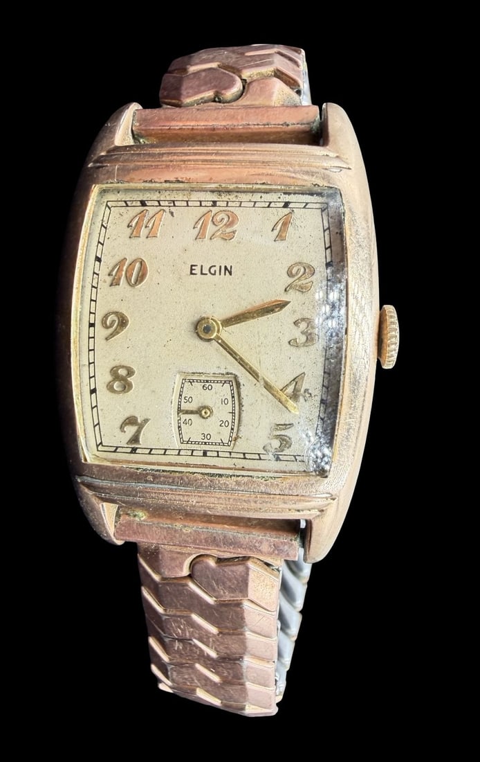 Vintage ELGIN Gold Filled & Beige Dial Wristwatch: Good vintage condition w/ patina and wear according to age and use, see pictures. Dial measures approx. 1" long and 3/4" wide and weighs ca. 42.15 grams. Marked for ELGIN. The timepiece is currently n