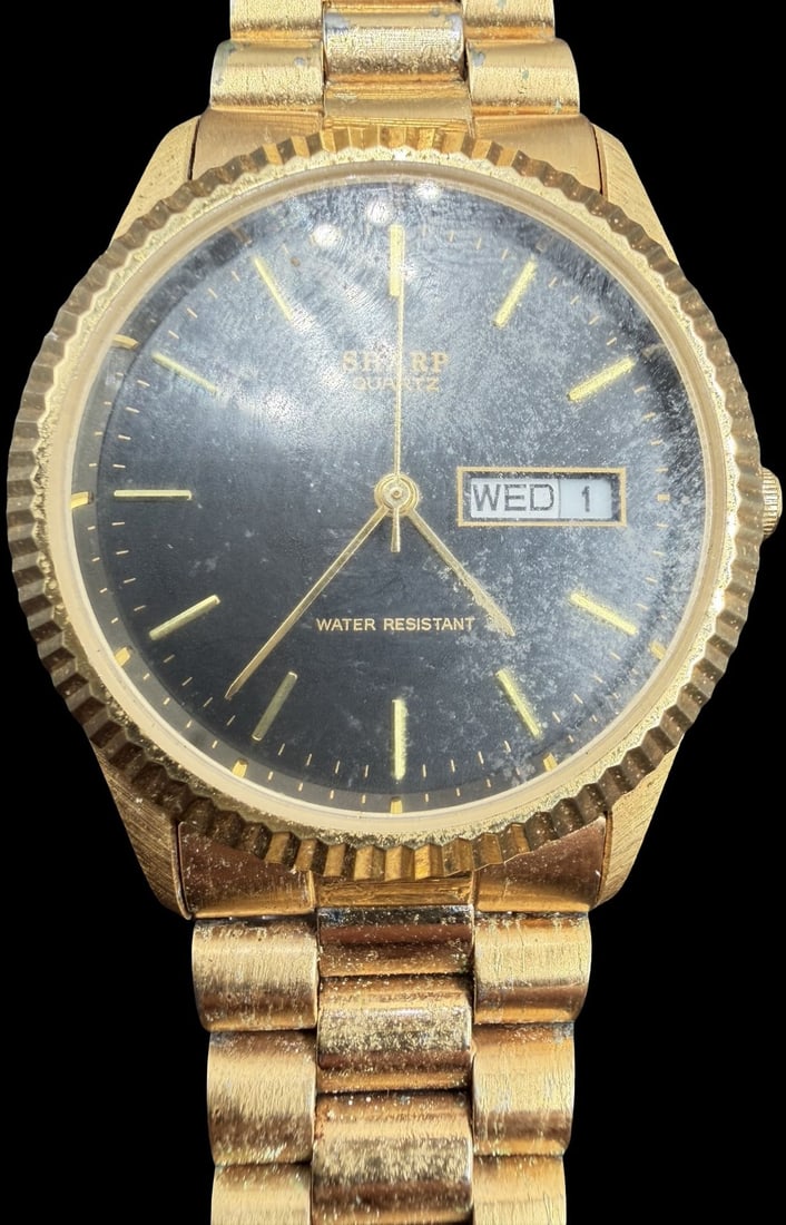 Gorgeous Vintage SMARP Stainless Steel Gold Tone & Black Dial Quartz Watch: Good vintage condition w/ patina and wear according to age and use, see pictures. Measures approx. 1" long and 1" wide. Marked for SMARP. Watch isn't working.