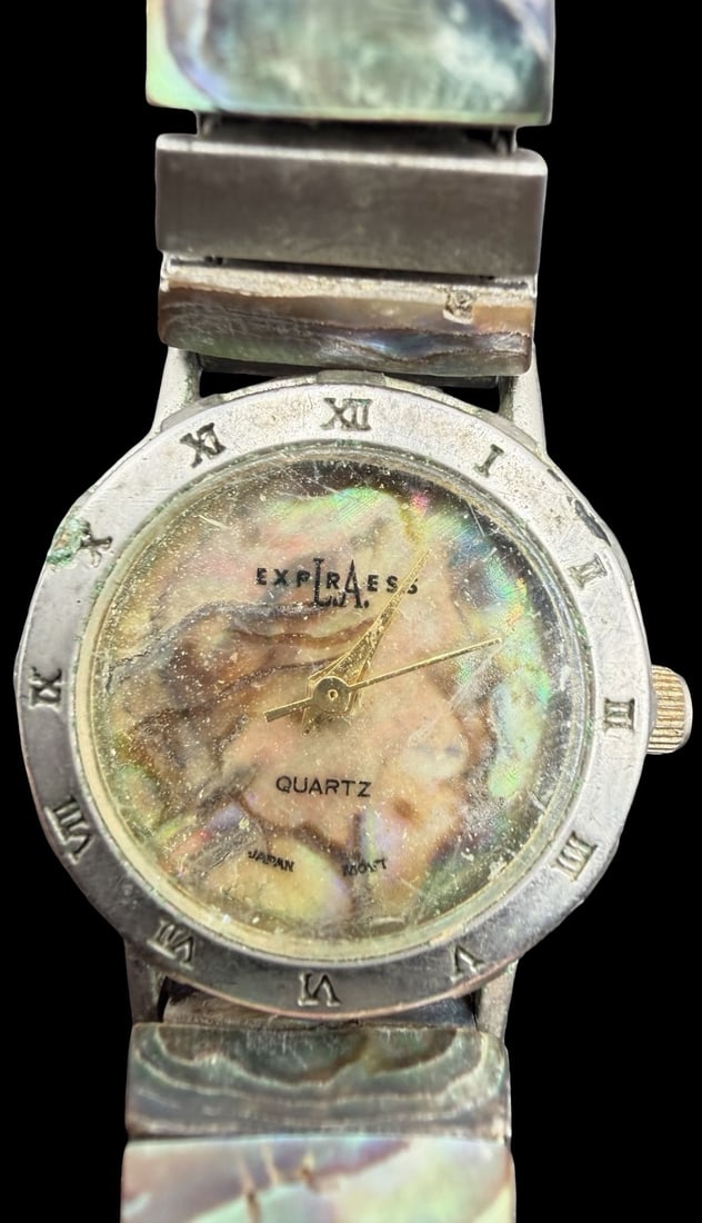 Unusual Vintage EXPIRAESS Mother of Pearl Quartz Watch: Good vintage condition w/ patina and wear according to age and use, see pictures. Measures approx. 3/4" long and 3/4" wide. Marked for EXPIRAESS. Watch isn't working. Strap is Stretchable.