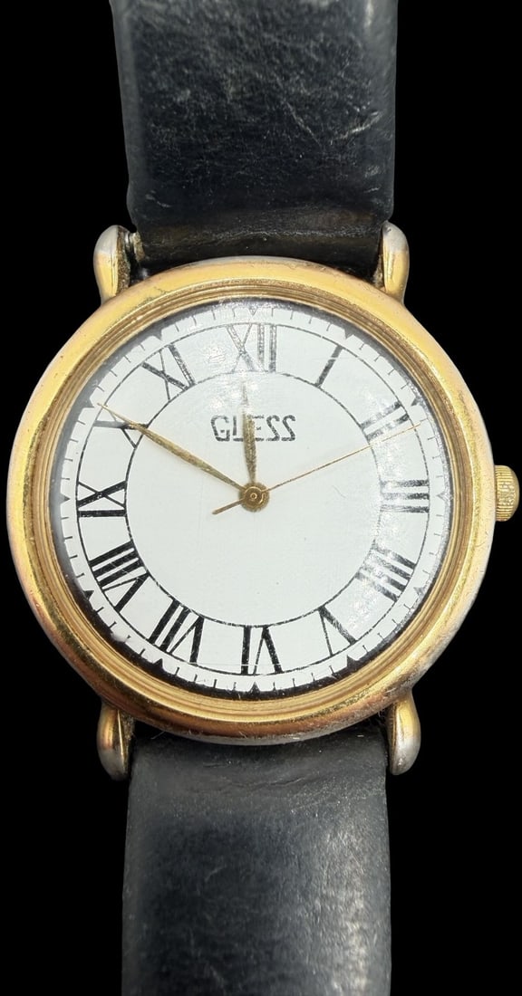 Gorgeous Vintage GUESS Stainless Steel Gold Tone & White Dial Quartz Watch: Good vintage condition w/ patina and wear according to age and use, see pictures. Measures approx. 1" long and 1" wide and weighs ca. 49.23 grams. Marked for GUESS. Watch isn't working.
