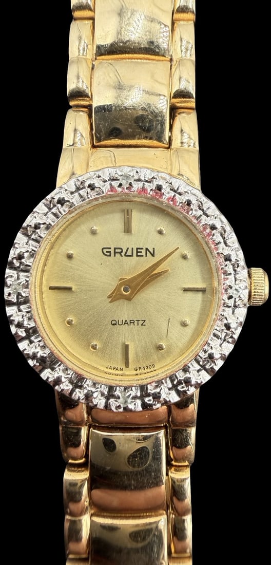 Gorgeous Vintage GRUEN Stainless Steel Gold Tone & Cluster Clean Rhinestone Quartz Watch: Good vintage condition w/ patina and wear according to age and use, see pictures. Measures approx. 1/2" long and 1/2" wide. Marked for GRUEN. Watch isn't working.