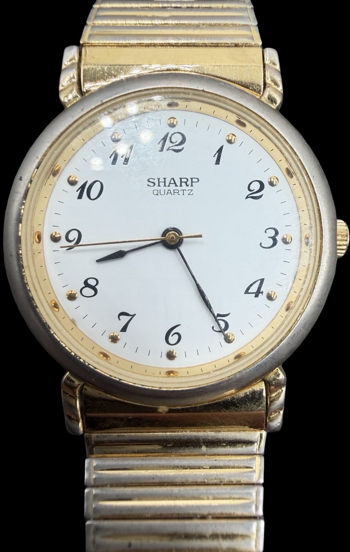 Gorgeous Vintage SHARP Gold Tone & White Dial Quartz Watch: Good vintage condition w/ patina and wear according to age and use, see pictures. Measures approx. 1" long and 1" wide. Marked for SHARP. Watch isn't working. Strap is Stretchable