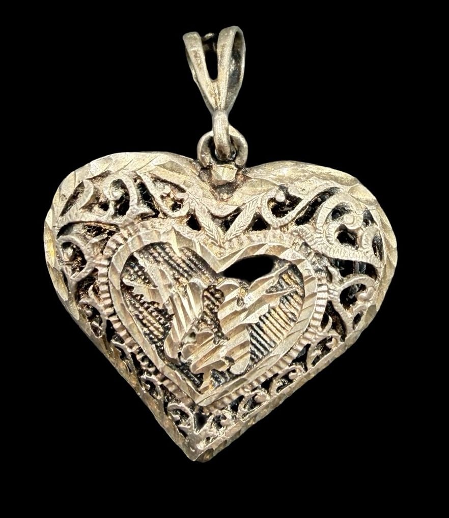 Stunning Ornate Vintage Sterling Silver Heart Pendant: Good vintage condition w/ patina and wear according to age and use, see pictures. Pendant measures approx. 1 1/2" long and 1" wide and weighs ca. 7.2 grams. Tested for Sterling Silver
