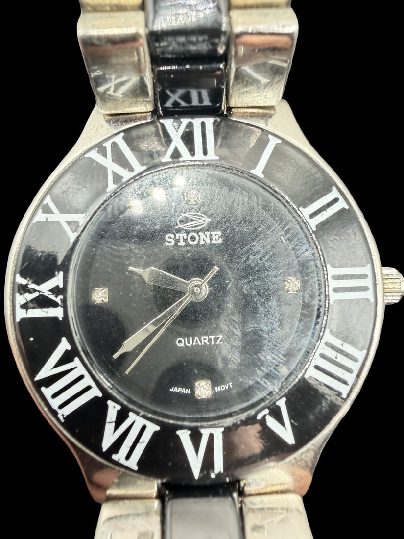 Amazing Vintage STONE Stainless Steel , Black & Gold Tone Quartz Watch: Good vintage condition w/ patina and wear according to age and use, see pictures. Measures approx. 1 1/4" long and 1 1/4" wide and weighs ca. 84.78 grams. Marked for STONE. Watch isn't working.