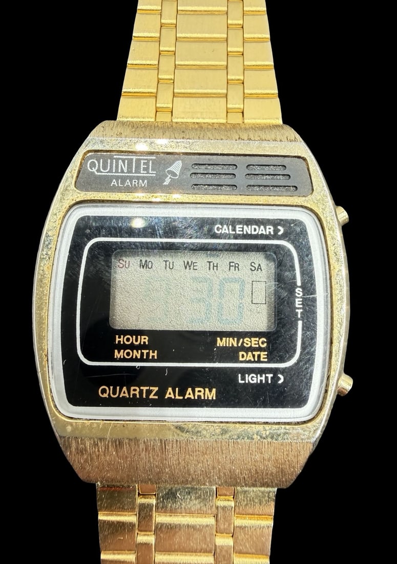 Amazing Vintage QUINTEL Stainless Steel Quartz Watch w/ Box: Good vintage condition w/ patina and wear according to age and use, see pictures. Dial measures approx. 3/4" long and 1" wide and weighs ca. 61.9 grams. Marked for QUINTEL. The timepiece is functional