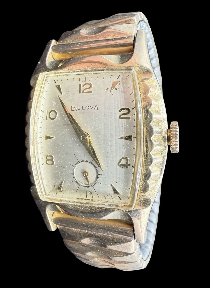 Vintage Mid-Century BULOVA Gold Filled Wristwatch: Good vintage condition w/ patina and wear according to age and use, see pictures. Dial measures approx. 1" long and 3/4" wide and weighs ca. 46.29 grams. Marked for BULOVA. The timepiece is working an