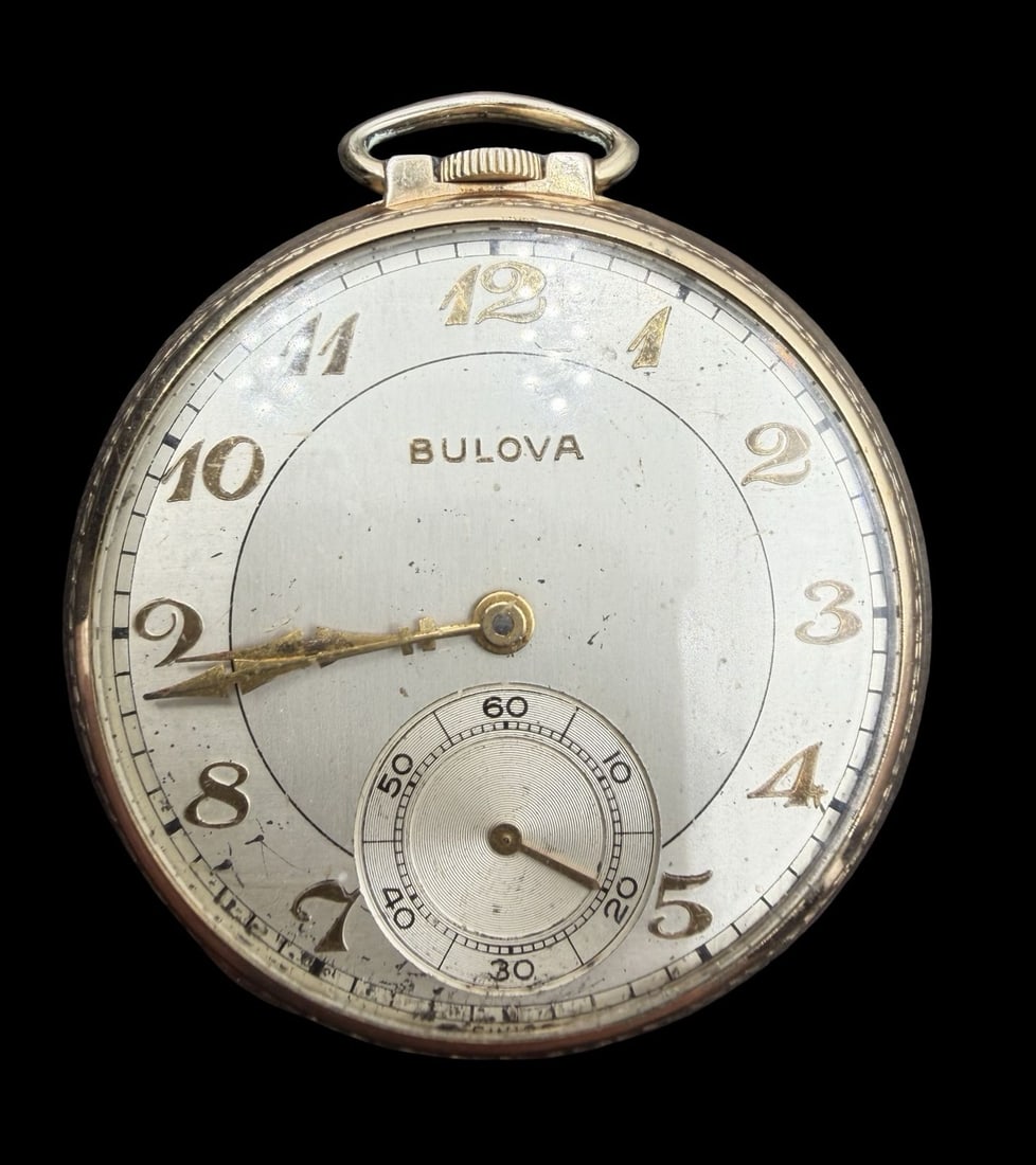 Vintage Mid-Century BULOVA Gold Filled Pocket Watch: Good vintage condition w/ patina and wear according to age and use, see pictures. Dial measures approx. 1 1/2" long and 1 1/2" wide and weighs ca. 48.11 grams. Marked for BULOVA. The timepiece is work