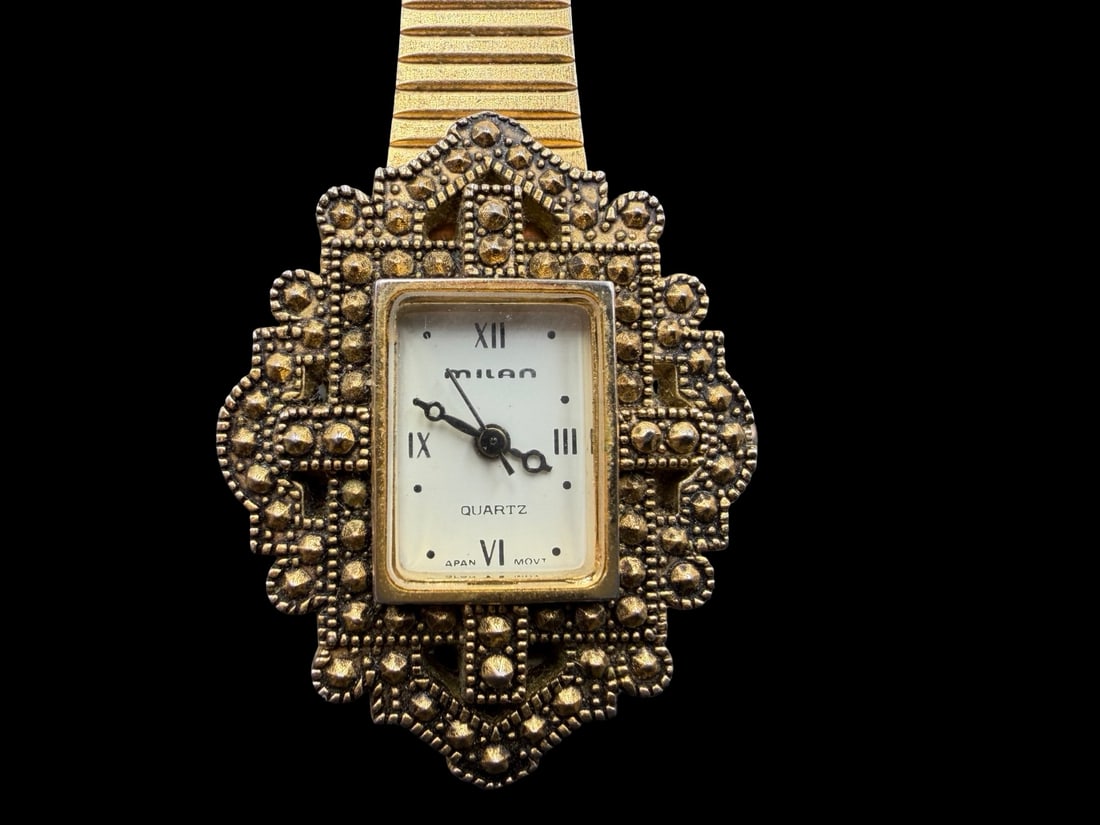 Stunning MILAN Ornate Vintage Gold Tone Stainless Steel Women's Women's Watch w/ Marcasite: Good vintage condition w/ patina and wear according to age and use, see pictures. Measures approx. 1 1/4" long and 1 1/4" wide and weighs ca. 35 grams. Marked for MILAN. Not Working.