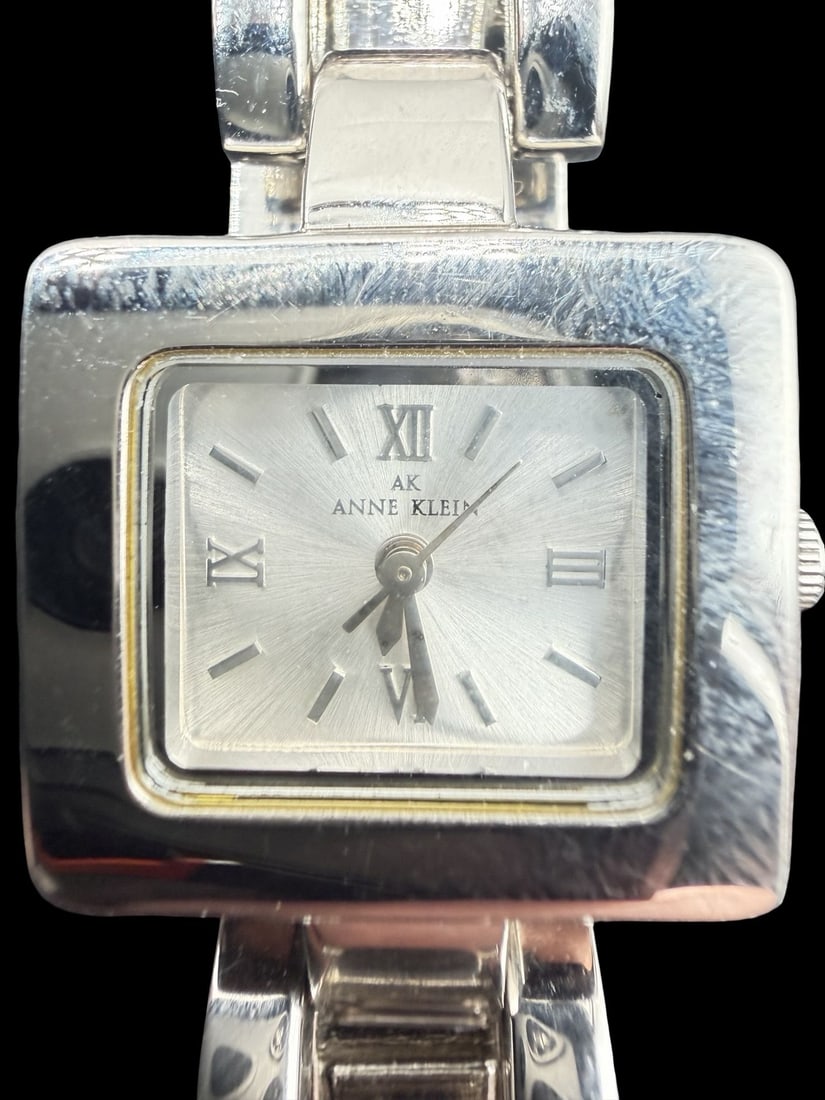 Vintage ANNE KLEIN Stainless Steel Silver Tone Ladies Watch: Good vintage condition w/ patina and wear according to age and use, see pictures. Dial measures approx. 3/4" long and 1/2" wide and weighs ca. 52.27 grams. Marked for ANNE KLEIN. The watch requires a 