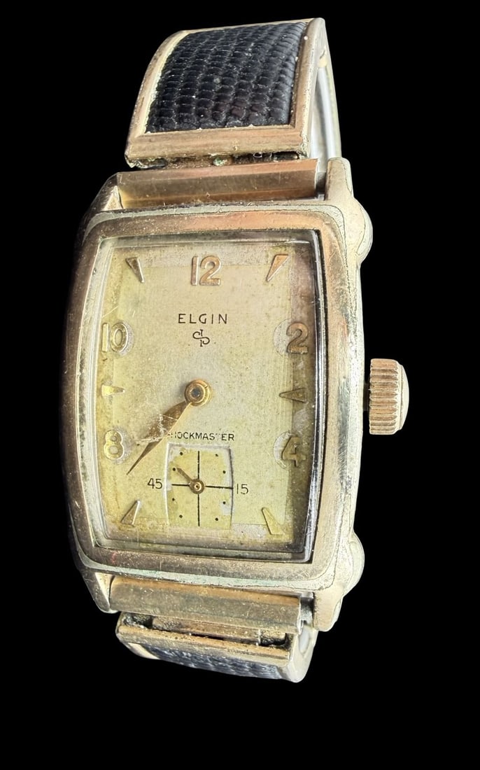 Vintage Mid-Century ELGIN Gold Plated & Beige Dial Ladies Wristwatch: Good vintage condition w/ patina and wear according to age and use, see pictures. Dial measures approx. 1" long and 3/4" wide and weighs ca. 48.72 grams. Marked for ELGIN. The timepiece is working and