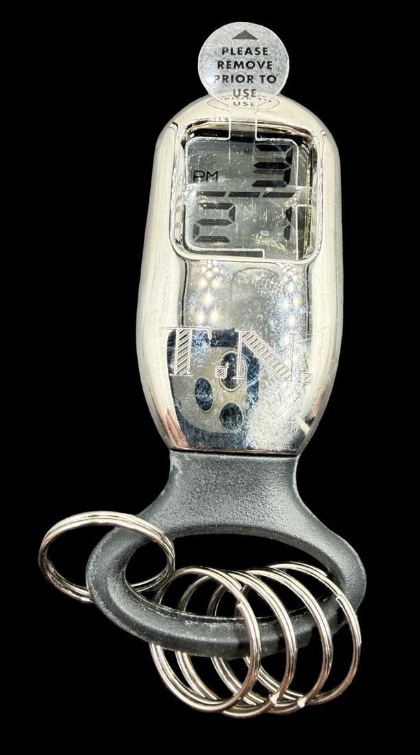 Gorgeous Vintage TECHTIME Stainless Steel LCD Display Watch w/ Key Rings: Good vintage condition w/ patina and wear according to age and use, see pictures. Dial measures approx. 3/4" long and 3/4" wide and weighs ca. 36.3 grams. Marked for TECHTIME. Watch is working