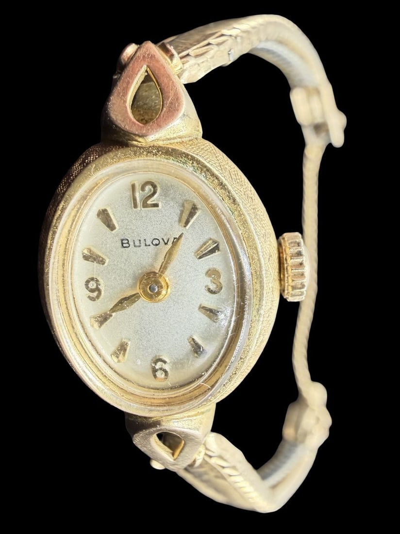 Vintage Mid-Century BULOVA Gold Filled & Beige Dial Ladies Wristwatch: Good vintage condition w/ patina and wear according to age and use, see pictures. Dial measures approx. 1/2" long and 1/2" wide and weighs ca. 11.22 grams. Not Working. Marked for BULOVA.