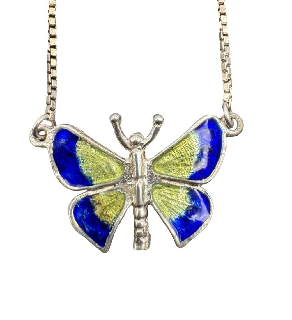 Whimsical & Colorful Sterling Silver & Enamel Butterfly Pendant Necklace: Very good vintage condition with minor patina according to age. Necklace measures approx. 17" long and the pendant measures approx. 0.75" long x 1" wide. Weighs ca. 6.79 grams. Marked for Sterling Sil