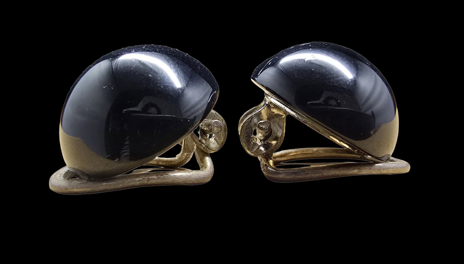 Beautiful Vintage Gilt Sterling Silver & Black Onyx Clip-On Earrings: Very good vintage condition with minor patina according to age. Each measures approx. 1" wide and they jointly weigh ca. 5.5 grams. Marked for Sterling Silver.