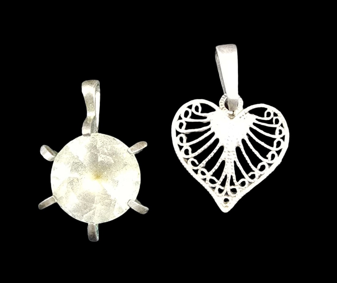 Lot of 2 Vintage Sterling Silver Pendant Charms: Very good vintage condition with minor patina according to age. Each measures approx. 1/2" long and weighs ca. 1 gram.