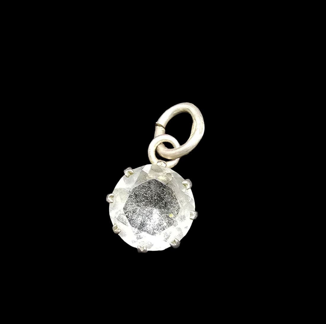 Beautiful Vintage Sterling Silver & Clear Rhinestone Pendant: Very good vintage condition with minor patina according to age. Measures approx. 1/2" wide and weighs ca. 0.5 grams. Marked for Sterling Silver.