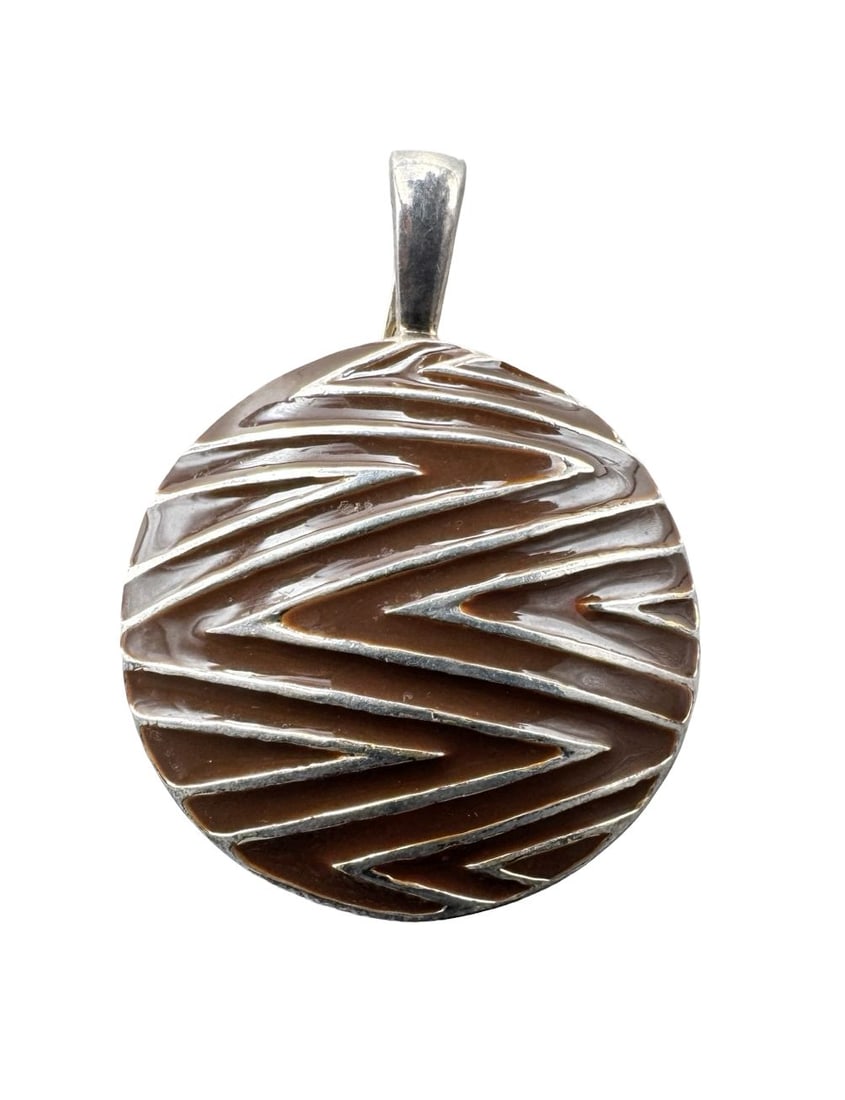 Striking Vintage DAVID SIGAL Sterling Silver & Brown Enamel Chevron Disk Pendant: Very good vintage condition with minor patina according to age. Measures 1 1/2" long x 1 1/2" wide. Weighs ca. 9.9 grams. Marked for Sterling Silver.