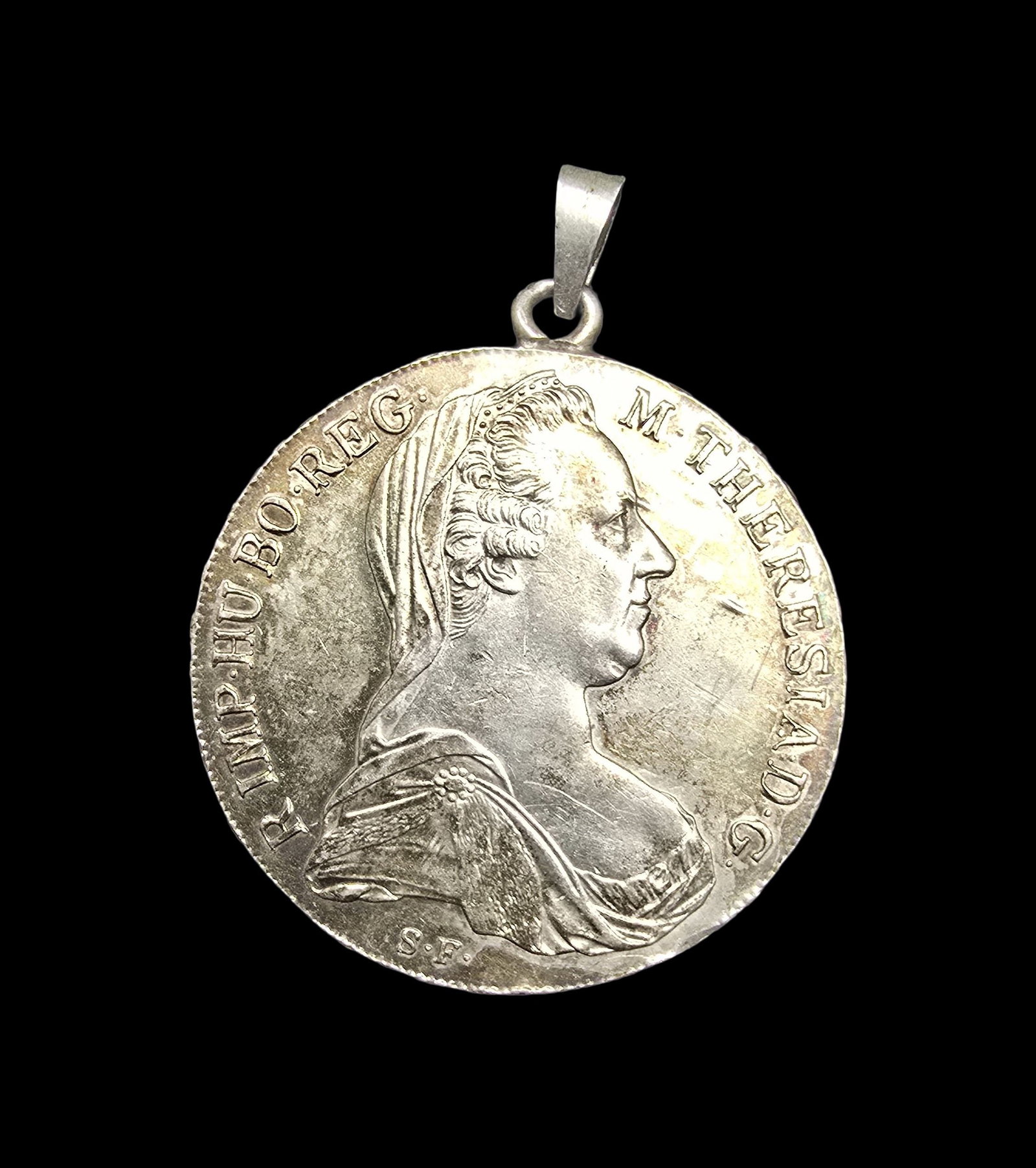 Amazing Antique 1780 Austrian Maria Theresia 833 Silver Coin Pendant: Very good antique condition with minor patina according to age. Measures approx. 1 1/2" wide and weighs ca. 28.5 grams. Coin is 833 silver; loop and bale are also silver.