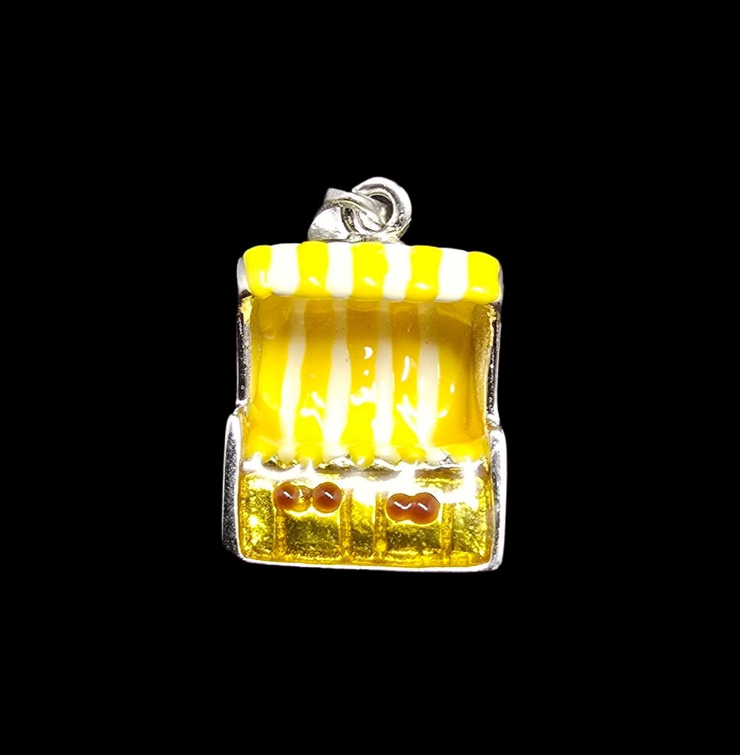 Unusual & Whimsical Vintage Sterling Silver Yellow & White Beach Chair Pendant: Very good vintage condition with minor patina according to age. Measures approx. 1/2" long and 1/2" wide and weighs ca. 2 grams. Marked for Sterling Silver.