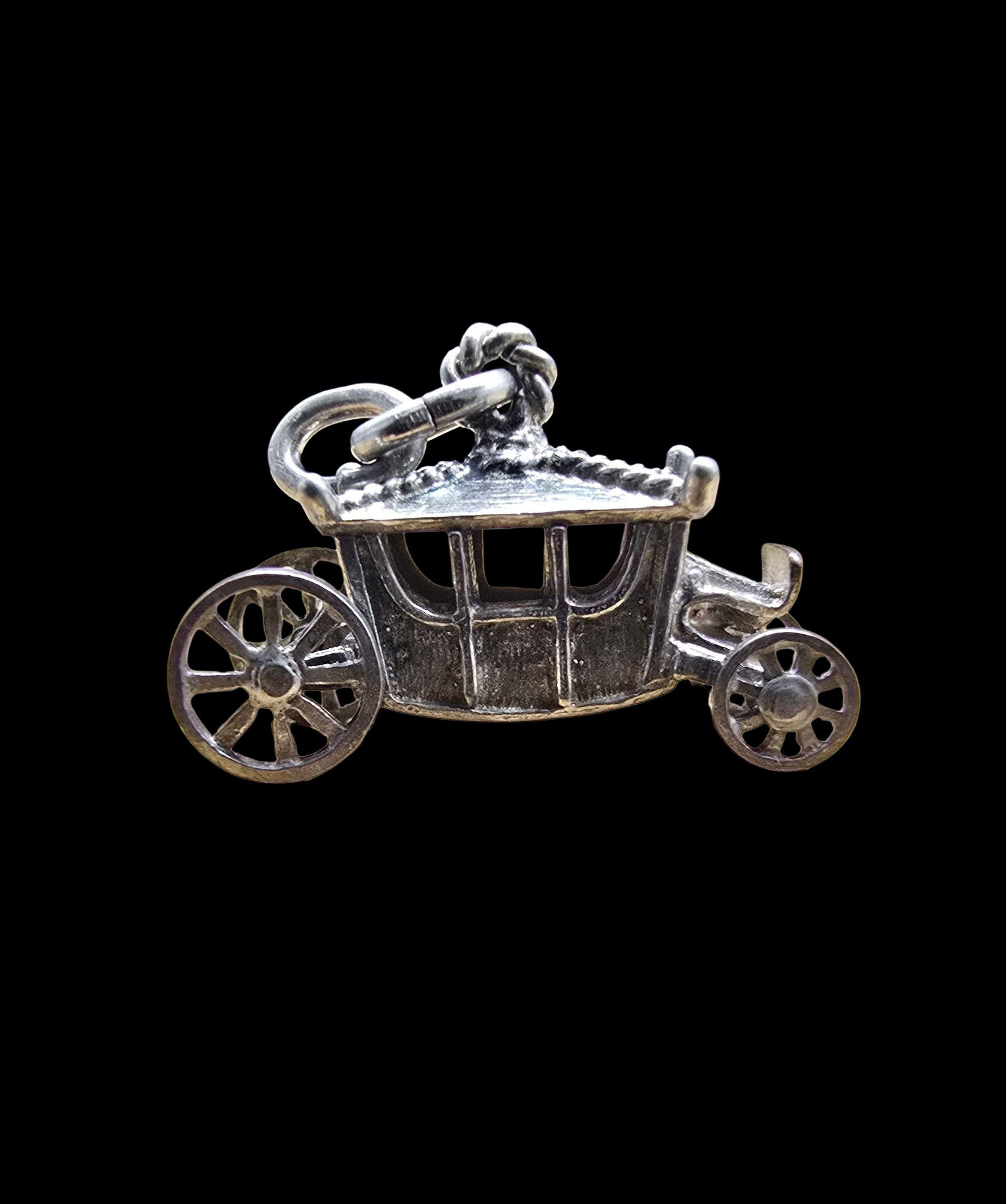 Unusual Vintage Sterling Silver Coach Carriage Pendant Charm: Very good vintage condition with minor patina according to age. Measures approx. 1" wide and weighs ca. 4 grams. Marked for Sterling Silver.