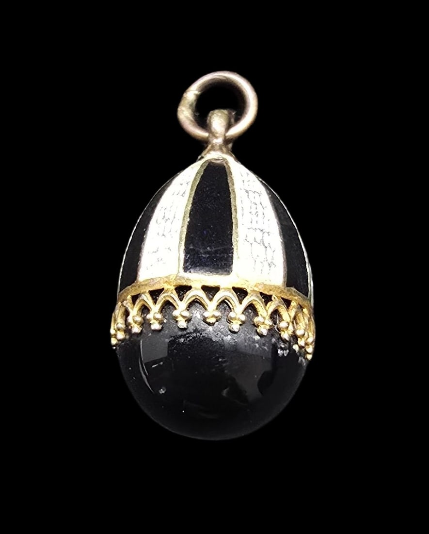 Unusual Vintage Gilt Sterling Silver, Enamel & Black Gemstone Egg Pendant Charm: Very good vintage condition with minor patina according to age. Measures approx. 1 " long and 1/2" wide and weighs ca. 5.5 grams. Marked for Sterling Silver.