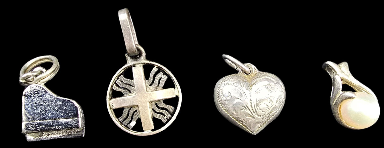 Lot of 4 Silver Pendant Charms: Very good vintage condition with minor patina according to age. Each measures approx. 1/2" high and weighs between ca. 1 - 2 grams. Partially marked; Tested for silver.