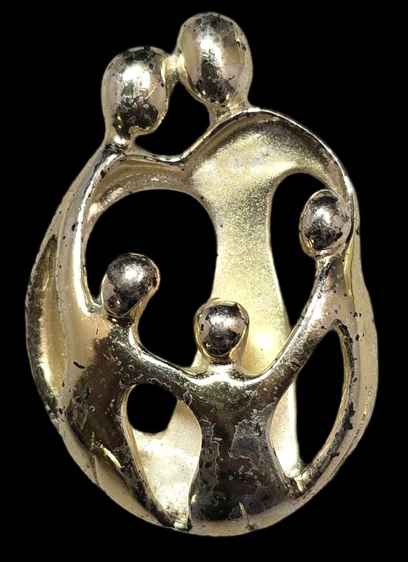 Vintage Sterling Silver "Family of Five" Designer Pendant: Good vintage condition with some patina and wear to the Rhodium plating according to age. Measures approx. 1 1/2" high and weighs ca. 8 grams. Marked for Sterling Silver. and carrying and unidentified